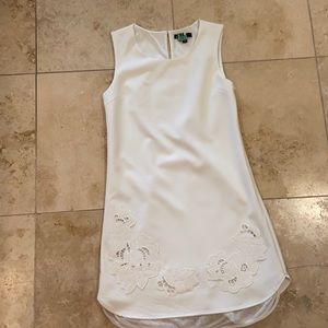 White Sleeveless Dress with Decorative Appliqués.